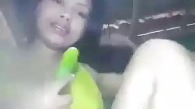 Naked Assamese girl fucks her pussy with a cucumber