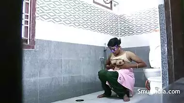 Mysterious Indian woman in purple mask washes nice body on camera